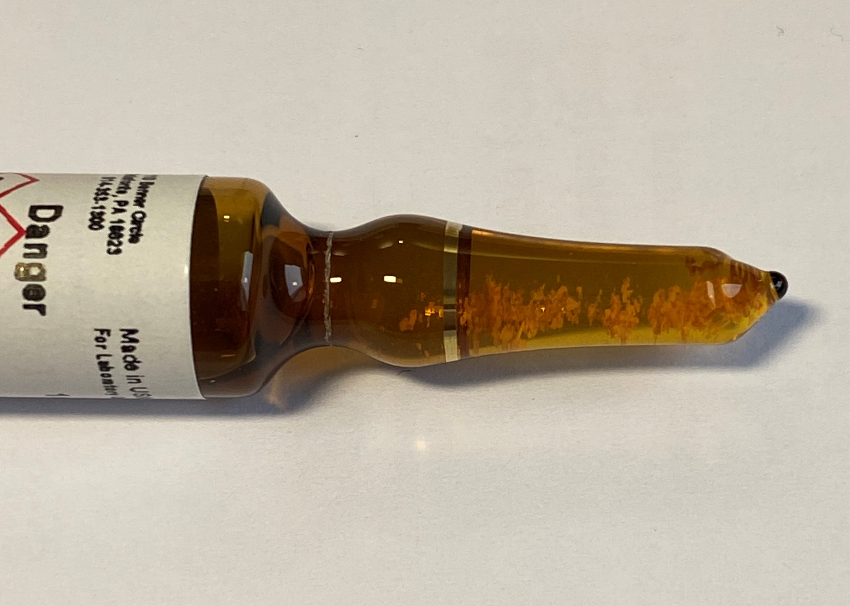 precipitates in a reference standard ampul