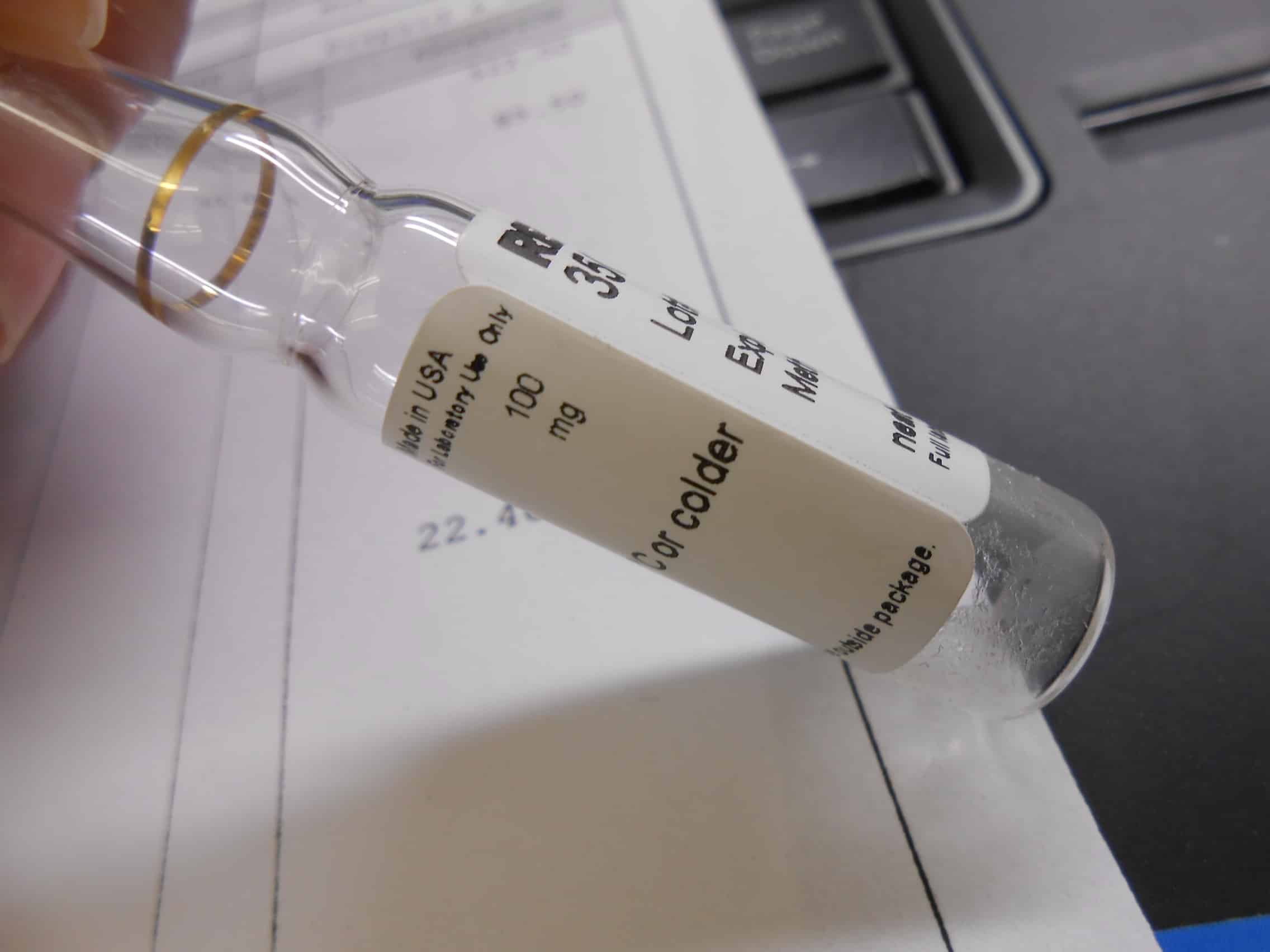 small volume of reference standard in an ampul