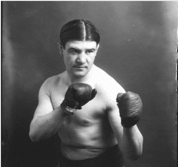 boxer posing with his gloves on