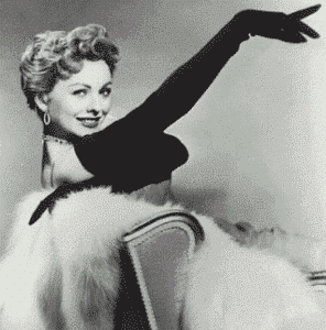 vintage photo of a woman wearing long opera gloves