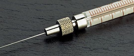 Closeup of KH, Knurled Hub / R, Removable Needle syringe termination