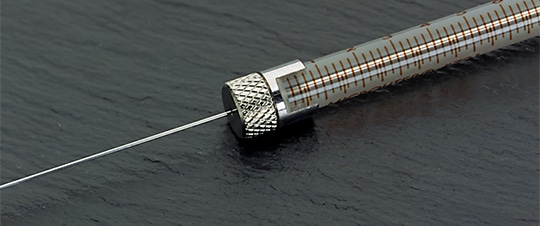 Closeup of RN, Removable Needle / R, Removable Needle syringe termination