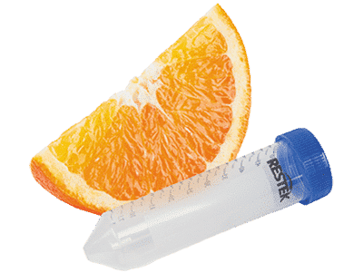 A delicious slice of orange beside a centrifuge tube.